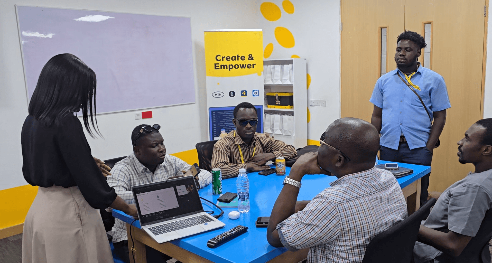Usability testing session: team observing a visually impaired participant navigating the app